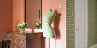 Molly Mahon fabric Leaf hanging as wallpaper at Firmdale Soho hotel and neatly finished off on a fabric mannequin standing in the room