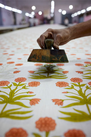Molly Mahon master block printers printing the hand blocked Mughal design in their studio