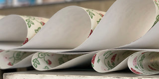 molly mahon strawberry wallpaper folding along the conveyour belt in its printing production to dry before being rolled up