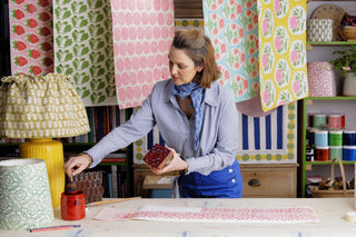 Molly Mahon printmaker's online course demonstrating in her studio with all her block printed examples
