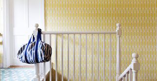 Molly Mahon wallpaper design fern filling a landing hall with delicious yellow light