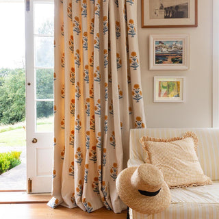 Morning/Kitchen room curtains using Molly Mahon Poppy Mustard Sky which bring a fresh and warm colour to the room with an arm chair finished off with a Seed mustard design to pull the fabrics together