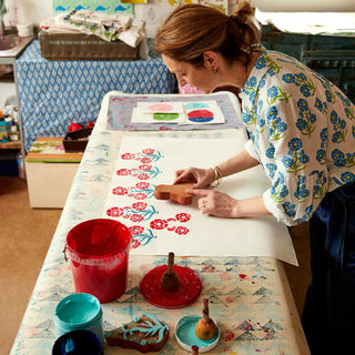 Molly Mahon block printing in her studio using the design she used with Boden