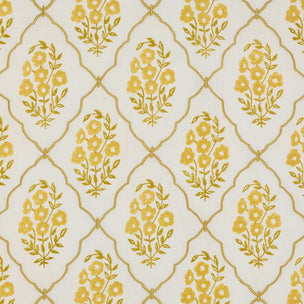 A close-up of a repeating fabric pattern featuring yellow floral bouquets enclosed in gold trellis ovals on a warm off-white background.