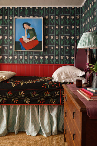 Luxury tulip wallpaper in green and black tones styled in a bedroom
