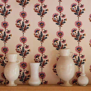 Image of Moly Mahons new Dianthus wallpaper with a shelf on the wall and a row of white vases lined up on the shelf.
